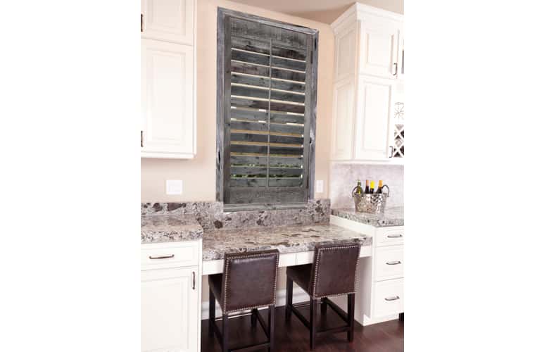 Kitchen window with reclaimed wood shutters in Charlotte